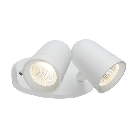 A contemporary white double spotlight fixture featuring sleek, adjustable cylindrical heads that provide bright illumination from an oval base. Ideal for modern interiors and accent lighting, this fixture echoes the efficiency and style of the Outdoor 18W LED White Twin Spot Floodlight.