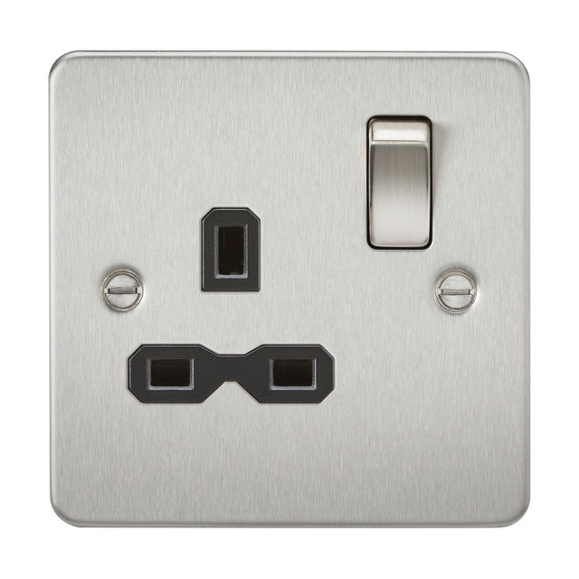 Product Description: The 13A 1 Gang DP Switched Socket - Brushed Chrome (Black Insert, Flat Plate) features a flat plate design with a brushed chrome finish. It includes a switch positioned on the upper right side and is designed for three-prong plugs. Two visible screws on either side allow for secure mounting.