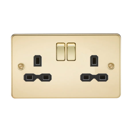 This 13A 2 Gang DP switched socket features a polished brass design with twin earths, a flat plate, and black inserts. The double electrical wall socket includes two switches and plug outlets, finished in glossy brass with screw fixtures on each side.