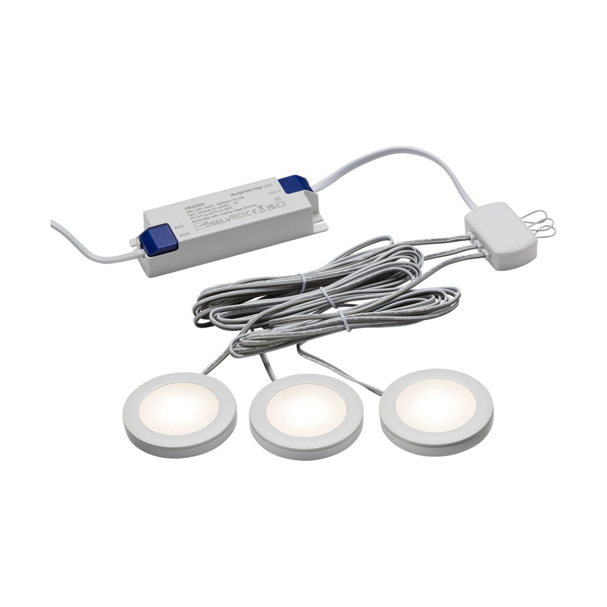 The 2.5W LED Under Cabinet Lights Dimmable White 3 Pack - 3000K consists of three round puck lights emitting a warm white glow. They are linked with long wires to a power adapter, featuring a flat white design with a glowing center, ideal for under-cabinet or accent lighting.