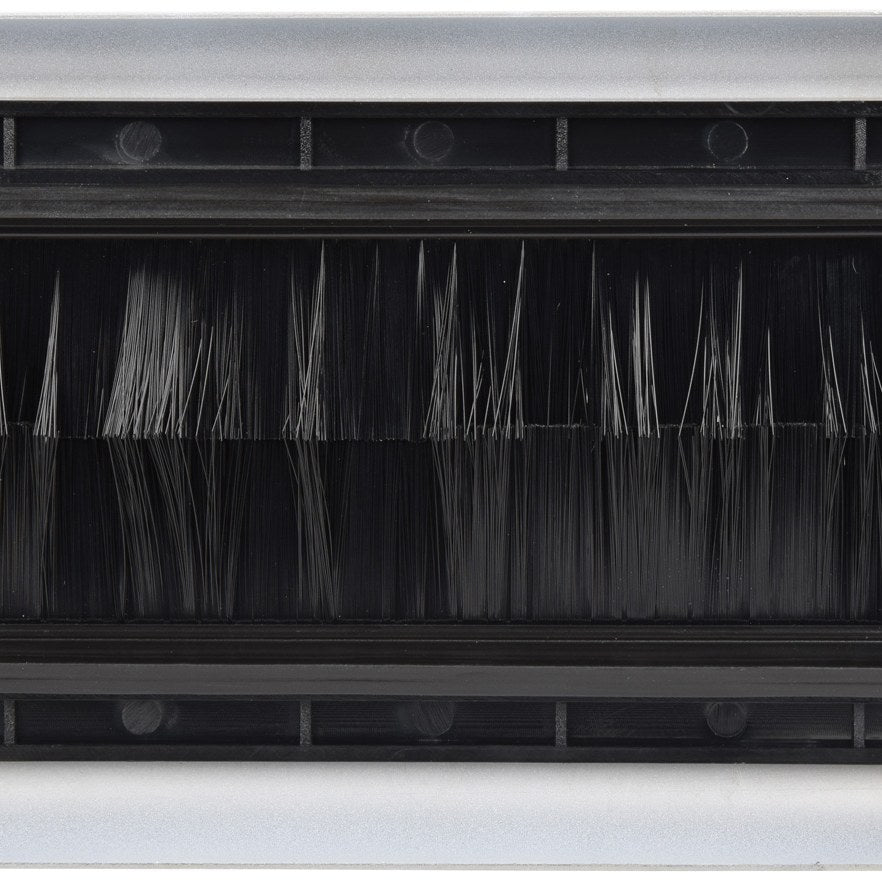 Close-up of the AV:Link double gang steel brush wallplate by AVSL, showing the white frame and twin black bristle brushes filling the cable aperture.