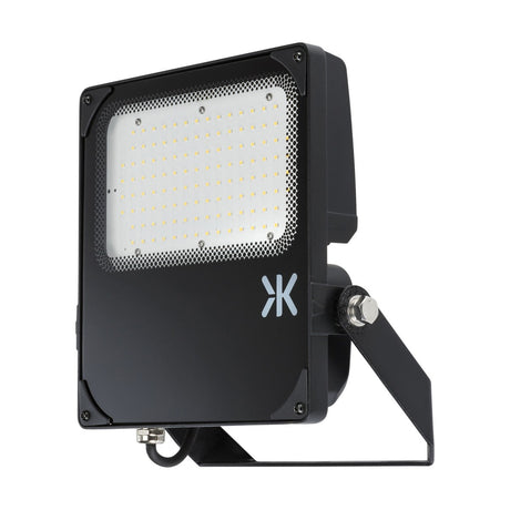 Introducing the Outdoor 100W IK08 Floodlight 4000K, a durable rectangular black LED floodlight with IP66 rating. It features an array of small LED lights protected by a sturdy cover, incorporates glare control technology, and comes with a side-mounted bracket for easy installation.