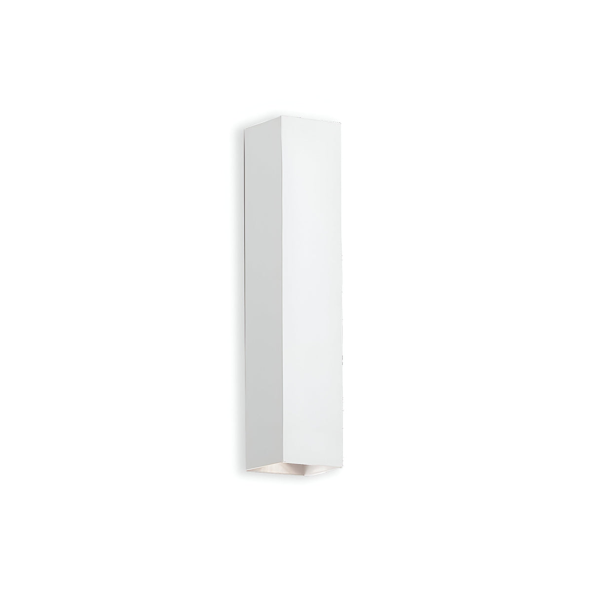 The Stellar 2 Light Wall Light in white, with its minimalist rectangular design, is mounted against a plain white background. This wall sconce emits soft illumination from the bottom, enhancing its modern aesthetic with ambient lighting.