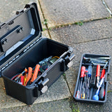AVSL Mercury MTC-37 IP67 waterproof case in matte black polypropylene, open on paving with tools inside and removable tray of screwdrivers alongside.
