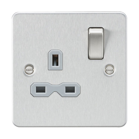 Introducing the 13A 1 Gang DP Switched Socket in Brushed Chrome with a Grey Insert, designed in a sleek flat plate style. This wall power socket features a toggle switch and three-pin plug holes, with two visible screw heads on each side for an elegant appearance.