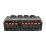 AV:Link AD-SPK42 4-way loudspeaker selector switch in black with red spring clip terminals for four speaker pairs and amplifier, rocker switches on top.