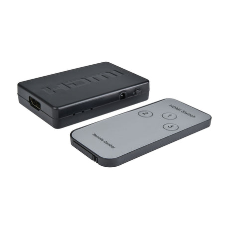 AV:Link 3-port HDMI switch, compact black metal unit with HDMI input port and status LEDs, shown beside grey IR remote with numbered buttons.