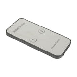 AV:Link HDMI Switch IR remote control in black with silver face, showing numbered 1 and 2 source selection buttons, on a plain white background.