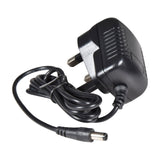 Black mains plug power adapter with coiled cable and barrel connector, shown on a plain white background.