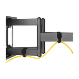 AV:Link FMXL600 full motion TV wall bracket close-up showing black double arm, hinge joint and hook and loop straps routing a yellow cable.