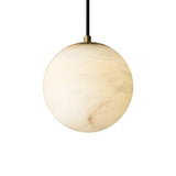The Lyvane 1 Light Small Globe Alabaster Single Pendant Light in Soft White features a subtly marbled frosted globe, suspended from a black cord and brass fixture, shown against a plain white background.