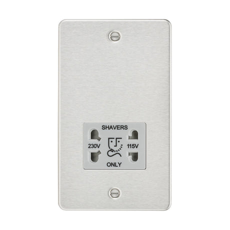 The 115/Dual Voltage Shaver Socket in a brushed chrome finish features a wall-mounted, low-profile design with two visible screws. It includes dual voltage sockets for shavers, accommodating both 230V and 115V plugs.