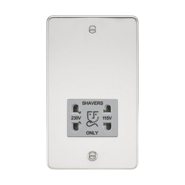 A 115/dual voltage shaver socket in polished chrome, featuring 230V and 115V options, is mounted on a flat plate with a sleek grey insert. This ultra low profile design includes two screws for installation at the top and bottom, providing a stylish touch that enhances modern bathroom aesthetics.