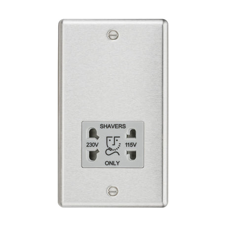 The 115/Dual Voltage Shaver Socket provides a wall-mounted electrical outlet with plug options for both 230V and 115V, making it ideal for travel kits. It features a brushed chrome finish with a grey insert and rounded edge design, elegantly engraved with "SHAVERS ONLY" above the sockets.