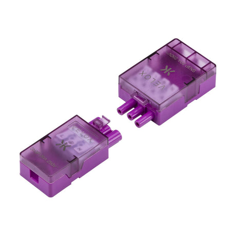 Close-up of two VELOX 20A 3-Pin Lighting Connectors in purple, featuring multiple prongs and labeled covers designed as push-fit terminals. Both connectors are detached, displaying their individual components for convenient cable inspection. The translucent finish on the surface ensures these connectors are maintenance-free and user-friendly.