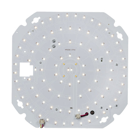 The TENAX 10-20W CCT Self-Test Emergency LED Gear Tray features a circular circuit board with numerous small, illuminated LED lights arranged in concentric patterns. This gear tray includes push-fit terminals and various connectors and components, all set against a white background.