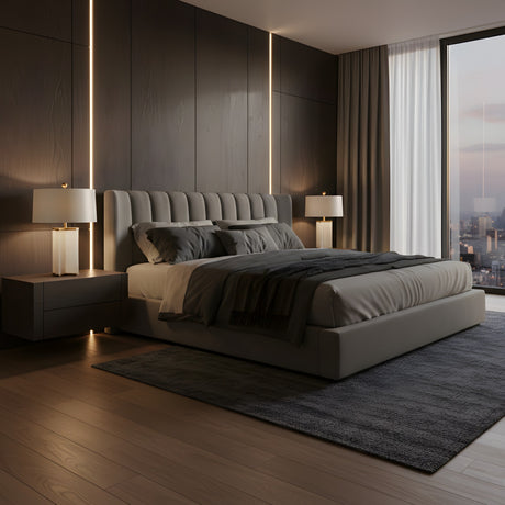 A modern bedroom with a large upholstered bed, Table 1 Light Column Alabaster Table Lamps on bedside tables, dark wood walls, a floor-to-ceiling city-view window, gray rug, and soft ambient lighting.