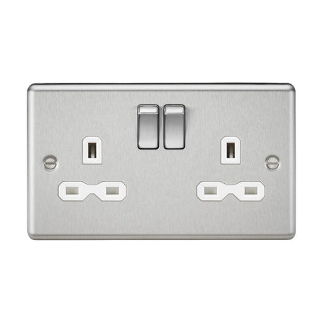 Here's a revised version of the sentence using the provided product data:

A 13A 2 Gang DP Switched Socket with Twin Earths in brushed chrome, featuring a white insert and a chic rounded edge design. It includes two UK standard plug outlets and two rectangular switches above them, making it an elegant addition to any contemporary space.