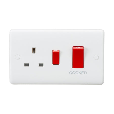 This 45A DP Switch & 13A Socket, made from durable thermoset resin for increased longevity, includes a white electrical wall socket with a three-pin plug outlet. It features two red switches labeled ON, with COOKER written underneath, making it ideal for kitchen appliances.