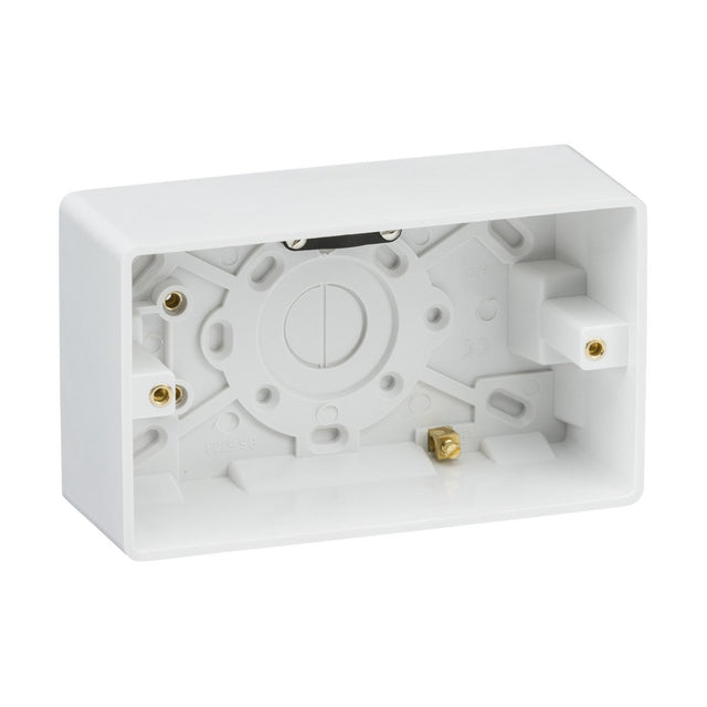 A Double 47mm Pattress Box with Earth Terminal and Cable Strain Relief, made from durable plastic, ensures secure housing for wiring connections. It features multiple entry points and mounting holes, with a rectangular shape, curved edge, and open side for easy installation.