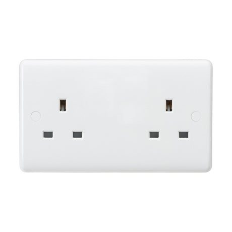 This is an image of the 13A 2 Gang Unswitched Socket (Rounded Edge), a white double electrical wall socket featuring two outlets made from thermoset resin. The socket includes three rectangular pin holes for each outlet, which are typical in the UK, and has an IP20 rating. Its minimalistic design features no visible switches or branding.