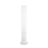 The Lumira Round Outdoor Bollard Light in White showcases a sleek, cylindrical design paired with a white shade to emit diffused lighting. It rests on a round base, featuring a minimalistic style and cast aluminum frame that complements modern interiors or outdoor lighting arrangements.