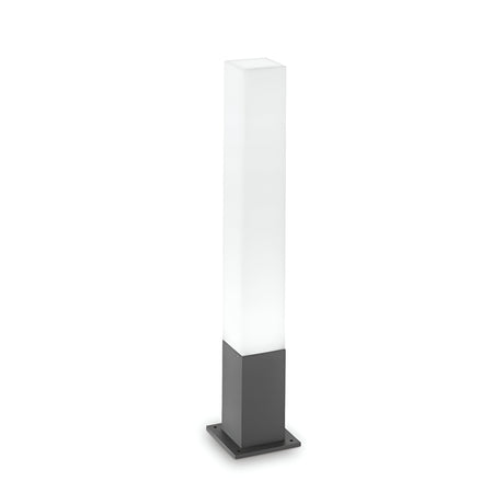 The Lumira Square Outdoor Bollard Light in Anthracite/White showcases a tall rectangular white shade paired with a sleek, anthracite square base, expertly crafted from cast aluminum. This modern outdoor lighting solution is perfect for minimalist and contemporary spaces.