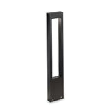 The Phasia Outdoor Pedestal Light - Black is a tall, rectangular modern fixture crafted from black metal with a hollow center, designed to provide ambient lighting and equipped with IP44 protection for enhanced durability.