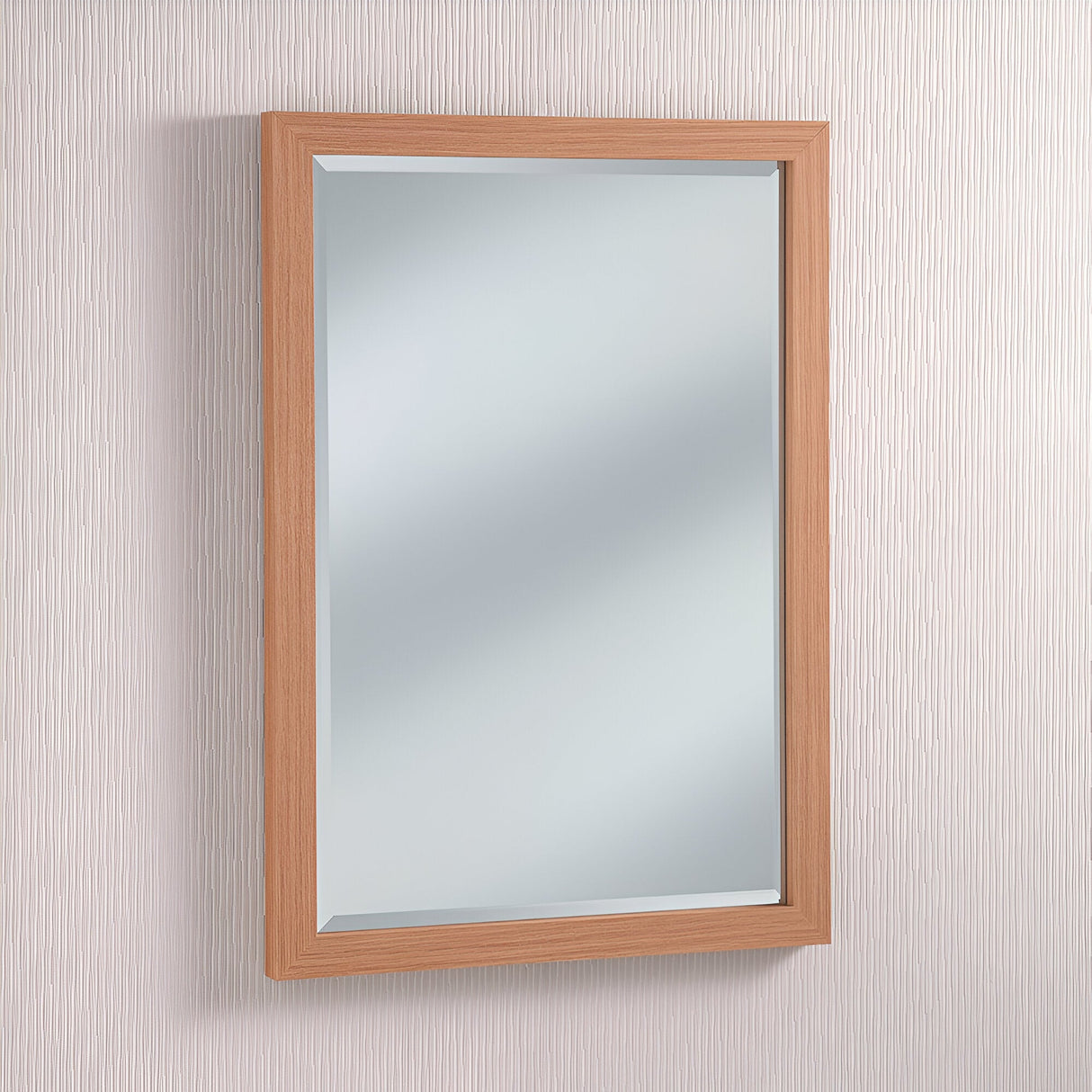 The rustic elegance of the Eden Rectangle Wall Mirror - Oak is highlighted by its graceful presence on a textured white wall.