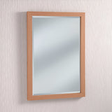 The rustic elegance of the Eden Rectangle Wall Mirror - Oak is highlighted by its graceful presence on a textured white wall.