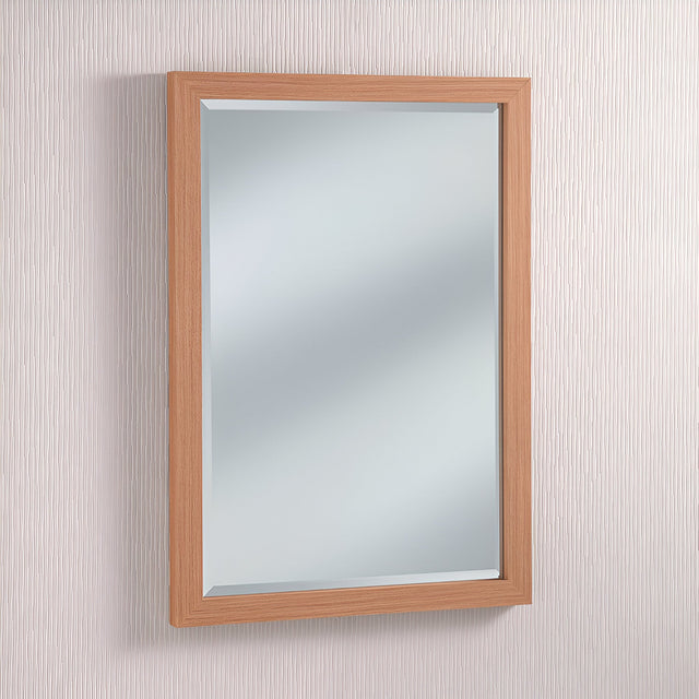 The rustic elegance of the Eden Rectangle Wall Mirror - Oak is highlighted by its graceful presence on a textured white wall.