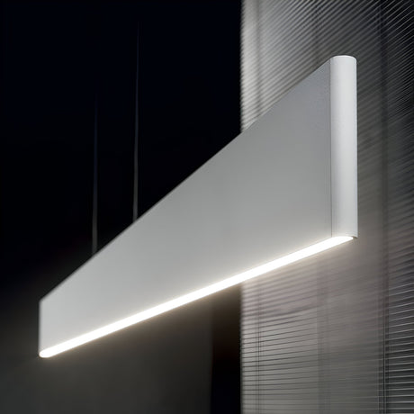 The Evoke LED Suspension Light in White, with its sleek and modern rectangular design, hangs from the ceiling. Made of aluminium, it emits a bright and even glow. The backdrop showcases textured translucent panels that enhance the contemporary and minimalist ambiance.