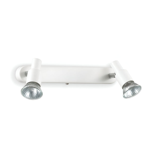 The Crest Twin Bar Spotlight in white is a contemporary ceiling fixture featuring GU10 bulbs and adjustable spotlights. Its sleek, minimalist design includes cylindrical bulb holders on a horizontal rectangular base, with the bulbs showcasing a metallic, reflective finish.