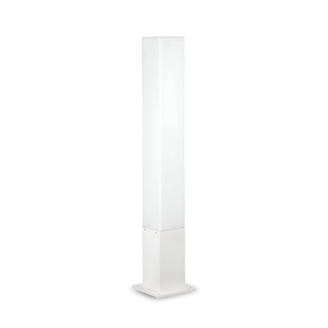 The Lumira Square Outdoor Bollard Light in white features a minimalist, tall rectangular design and a square base, crafted from durable cast aluminum. It emits a soft, ambient light through its white polycarbonate diffuser.