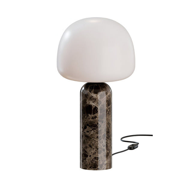 The Esmora 1 Light Marble Core Table Lamp features a glossy dark grey marble cylindrical base and a smooth white mushroom-shaped glass shade, with a black power cord and inline switch trailing from the base.