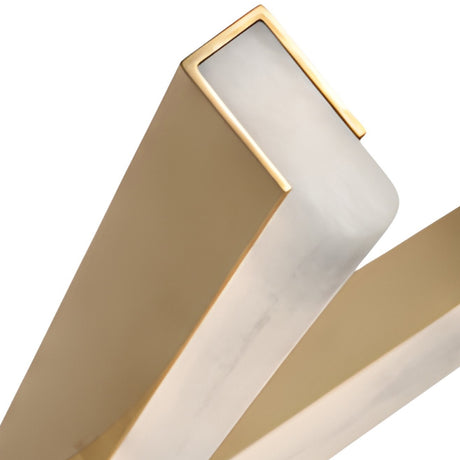 Close-up of intersecting beams in brushed brass and soft white, part of the Elvaris LED Alabaster Suspension Light, set against a white background. The modern design echoes the clean lines of contemporary linear lighting.
