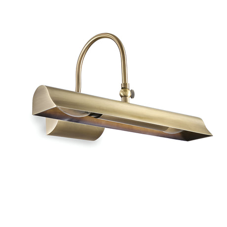 The Chroma 2 Picture Light - Brass is a fixture with an adjustable head, featuring a curved arm and elongated shade. Designed to illuminate artwork or photos, its antique finish highlights an elegant, classic style perfect for any gallery wall.