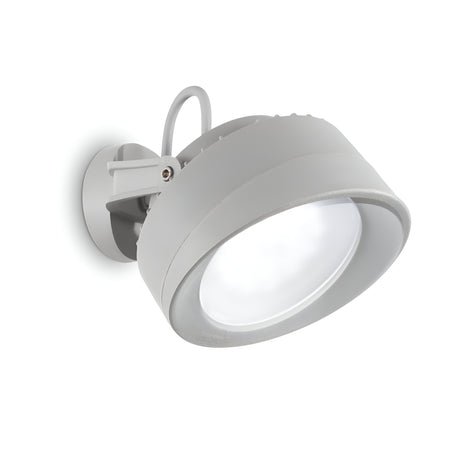 The Point-2 Outdoor Single Spotlight - Grey is a modern, circular wall-mounted light fixture featuring a sleek gray finish and a large, flat frosted lens that offers soft, diffused illumination. This corrosion-resistant fixture includes a cylindrical hinge for adjustable angles and has an IP66 rating, making it ideal for outdoor lighting.