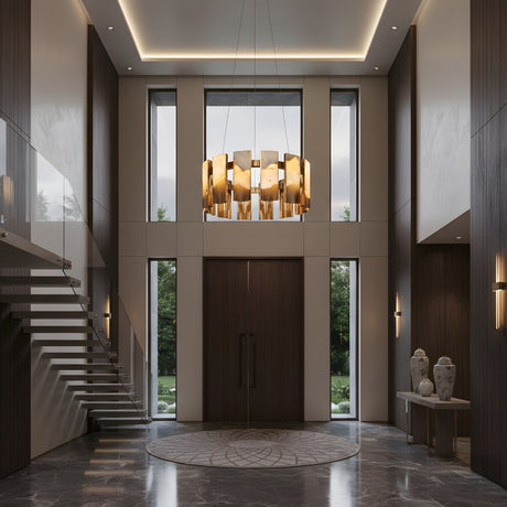 Modern entryway with tall double doors, large windows, floating staircase on the left, marble floor, and a Caelith LED Small Panel Alabaster Chandelier in brushed brass. Neutral colors and minimalist decor with vases on a console table to the right.