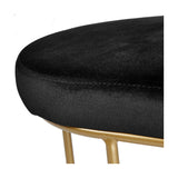 Close-up of the Nino Black Velvet & Gold Iron Bench, showing black velvet upholstery with stitched seams and slender gold iron legs on a white background.