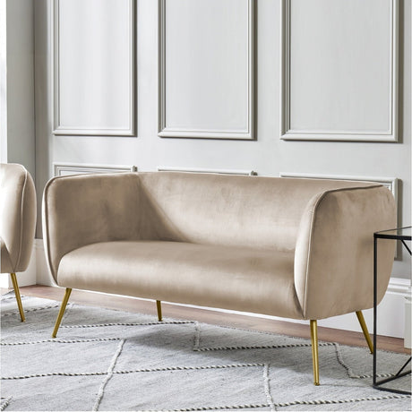 Lucca Biscuit Velvet & Iron Sofa, 142cm, with curved biscuit velvet upholstery and slim gold-tone metal legs, shown in a living room against panelled walls.