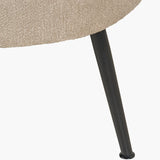 Close-up of the Aviana sofa's tapered black metal leg with rounded foot, set against the taupe teddy fabric upholstery on a plain white background.
