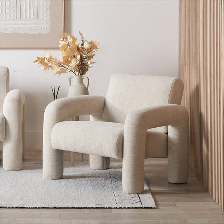 Ravello White Textured Fabric Armed Chair, 88cm wide, with rounded curved arms and chunky tubular legs, styled in a neutral living room beside a side table and vase.