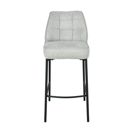 Enya bar stool with light grey chenille quilted back and seat on slim black metal legs with footrest, shown against a plain white background.