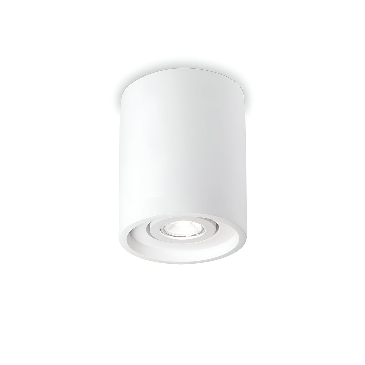 The Muse Round Downlight - White is a ceiling-mounted cylindrical fixture that includes a round downlight with a recessed bulb. Its straightforward and modern design, complete with a plaster finish, directs light downward in a clean and minimalist manner.