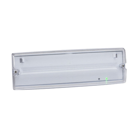 The Indoor & Outdoor 4W LED Emergency Self-Test Bulkhead (Maintained or Non-Maintained Use) is a rectangular clear plastic emergency exit sign with a ridged surface and two screw holes on each side. It features an LED emergency bulkhead design, includes a small green indicator light on the lower right corner, and boasts an IP65 rating for dependable performance in diverse conditions.