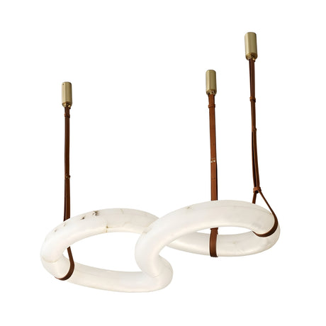 The Serava LED Medium Alabaster Loop Suspension Light in Brown & Soft White features two large, interlocking oval rings crafted from alabaster-like material, suspended by brown leather straps on brass ceiling mounts.
