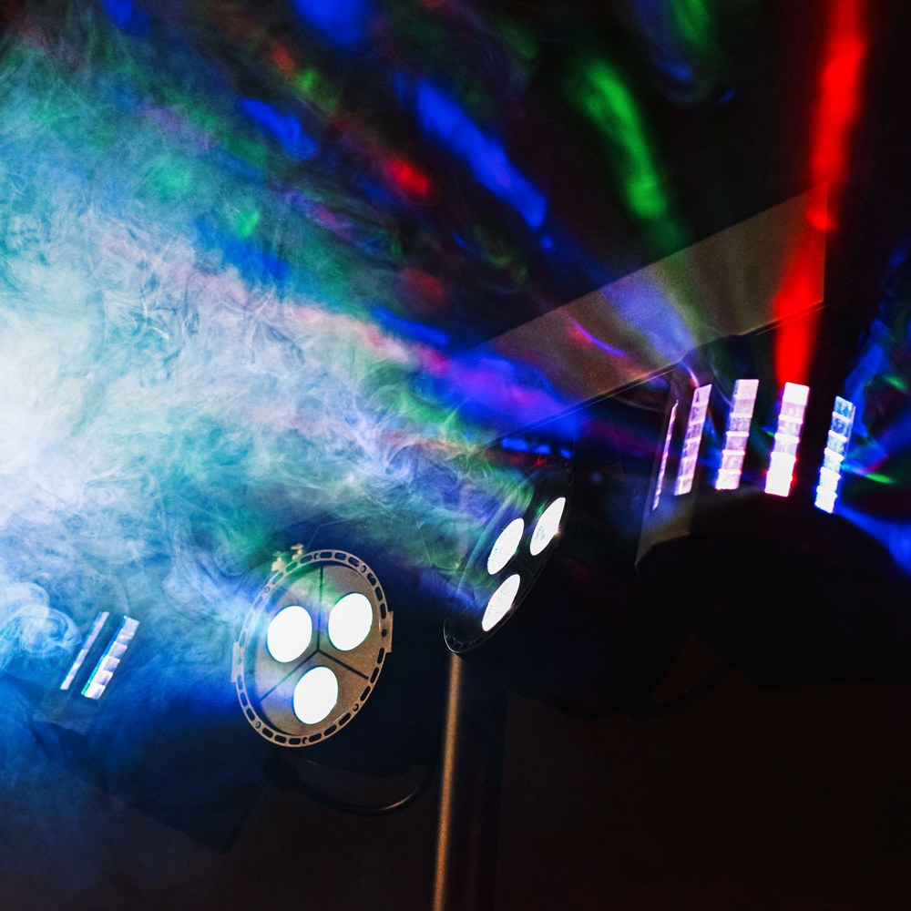 QTX Rechargeable LED Derby and Par Light Set on tripod projecting RGBW beams and Derby effects through haze in a darkened venue.