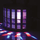QTX Derby9 LED derby light effect by AVSL, matte black cylindrical housing projecting purple, red and blue rotating beam patterns across a dark floor.