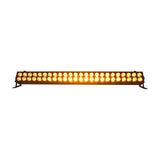 QTX DuplexBar LED wall bar by AVSL with 48 RGBA LEDs in two rows glowing amber, mounted on floor brackets against a white background.